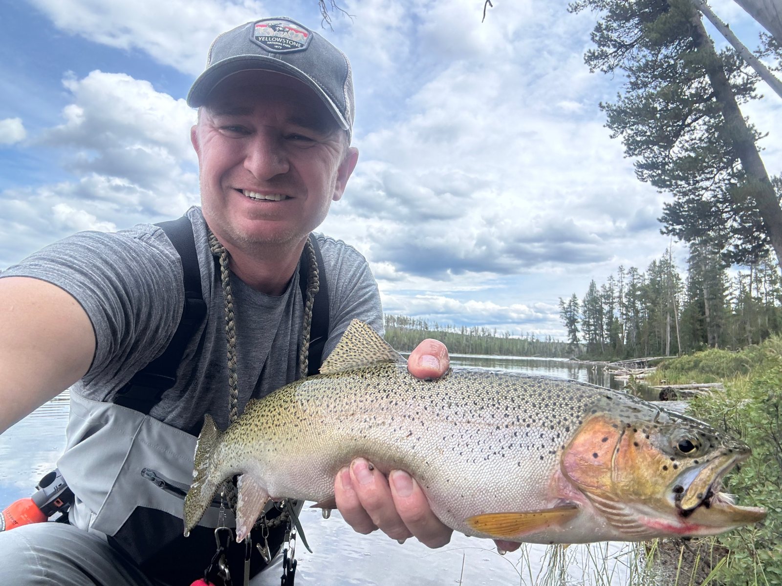 Trevor holding a Yellowstone cutthroat caught on a Parachute Adams